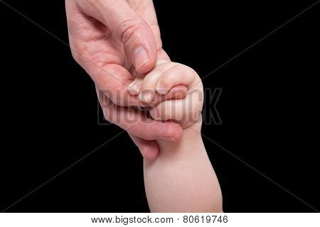 Mommy holding baby's hand