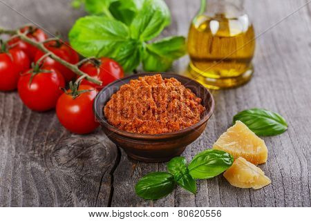 pesto sauce red rosso on a wooden surface