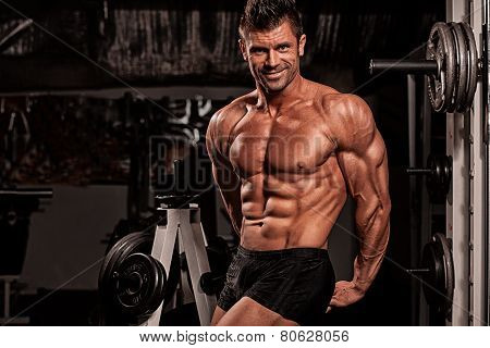 Bodybuilder Posing In The Gym