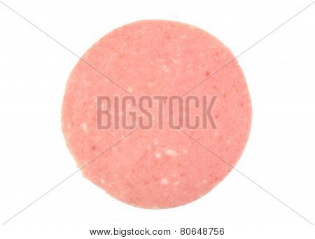 Closeup of one mortadela slice isolated on white background. Italian salami.
