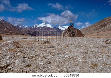 Young hiker sitting on the rock high in Pamir mountains in Tajikistan
** Note: Soft Focus at 100%, best at smaller sizes