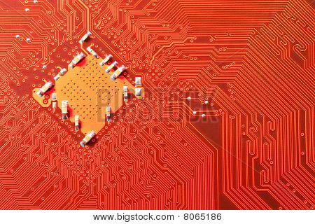 Closeup Of Computer Circuit Board In Orange