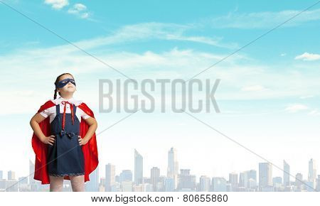 Girl of school age in super hero costume