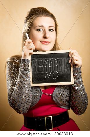 Smiling Woman Making Decision On White Chalkboard