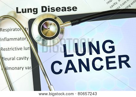 Tablet with word Lung cancer and stethoscope.