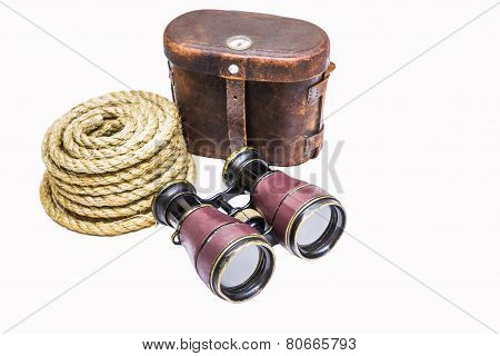 Antique binoculars with rope and leather case  isolated on white