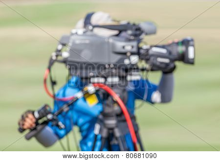 Blurred Image Of A Man Is Recording Vdo During Golf Tournament.