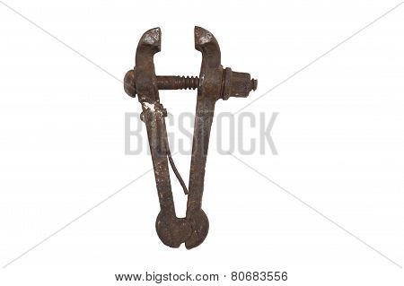 Old rusty bench vice, metal vice with a screw on a white background