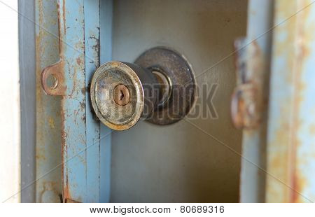 Old door knobs and a long scratch and rust.