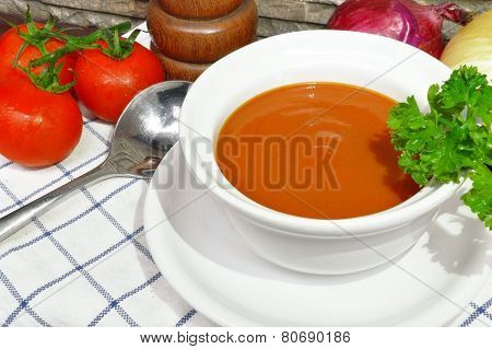 Tomato cream soup with parsley and mix up with
