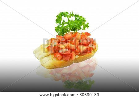 Tomato bruschetta decorated with parsley leaf
