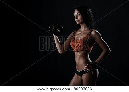 Brutal Athletic Woman Pumping Up Muscles With Dumbbells