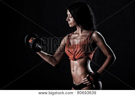 Brutal Athletic Woman Pumping Up Muscles With Dumbbells