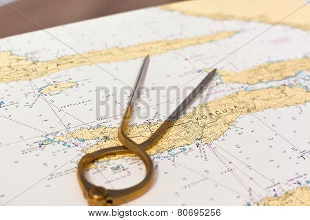 Pair Of Compasses For Navigation On A Sea Map