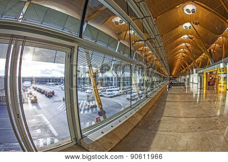 Passengers Walk By At The New Terminal T4 At Barajas Airport