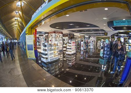 Passengers Walk By At The New Terminal T4 At Barajas Airport On April 1,2012 In Madrid. This Additio