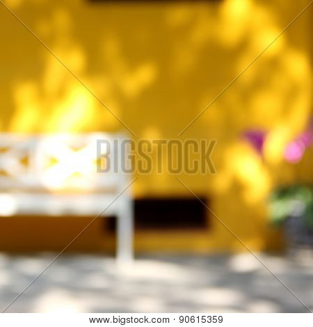 Blur Yellow House With White Chair