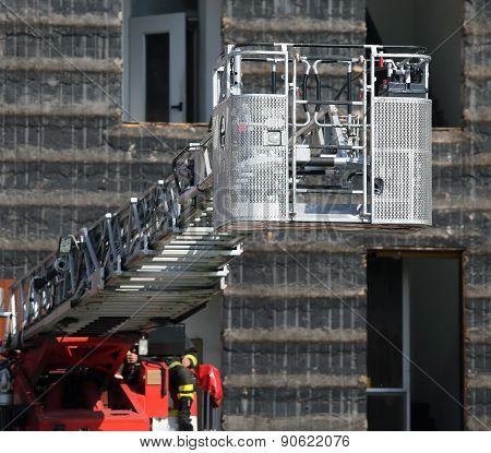 Big Ladder Rack Of Firefighters During Exercise In The Firehouse