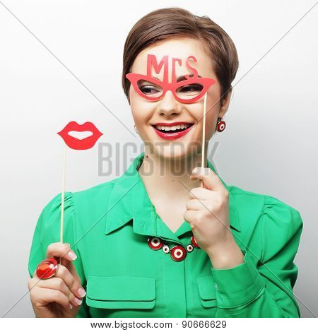 Attractive playful young woman ready for party - falce lips and glasses  