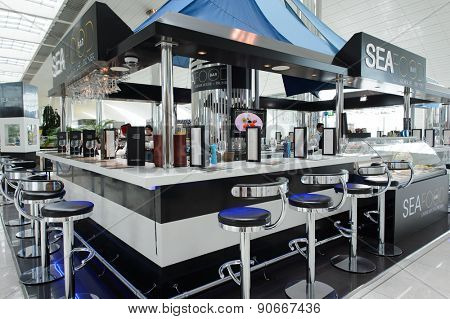 DUBAI, UAE - MARCH 10, 2015: DXB airport interior. Dubai International Airport is the primary airport serving Dubai, and is the world's busiest airport by international passenger traffic.