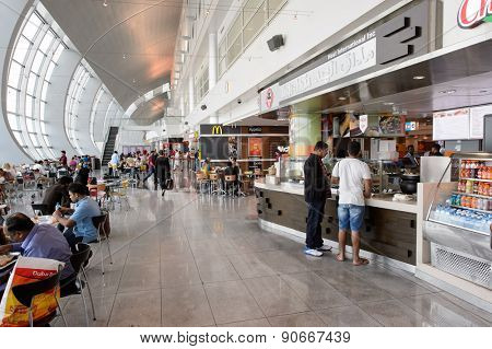 DUBAI, UAE - MARCH 10, 2015: DXB airport interior. Dubai International Airport is the primary airport serving Dubai, and is the world's busiest airport by international passenger traffic.