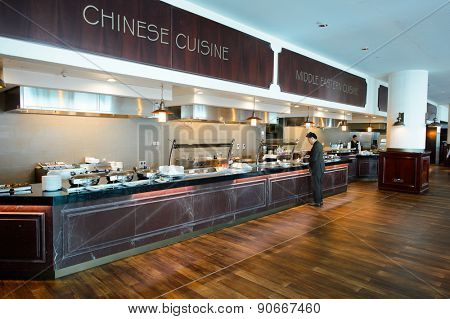DUBAI, UAE - MARCH 10, 2015: DXB airport interior. Dubai International Airport is the primary airport serving Dubai, and is the world's busiest airport by international passenger traffic.