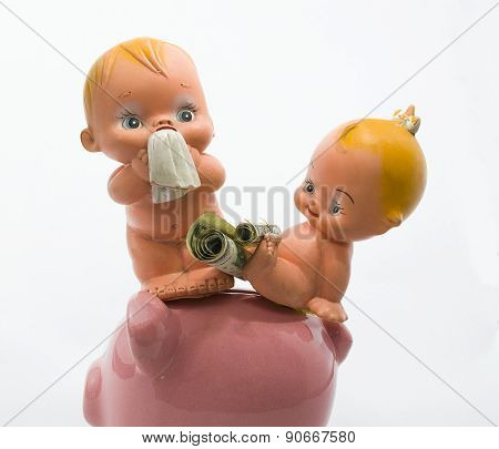 baby sitting on the floor with a piggy bank