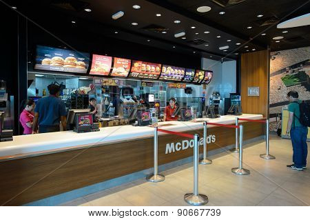 DUBAI, UAE - MARCH 10, 2015: DXB airport interior. Dubai International Airport is the primary airport serving Dubai, and is the world's busiest airport by international passenger traffic.