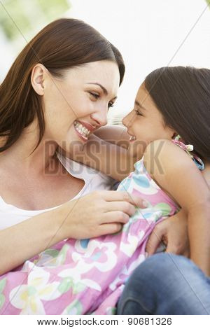 Mother and Daughter relaxing together outisde