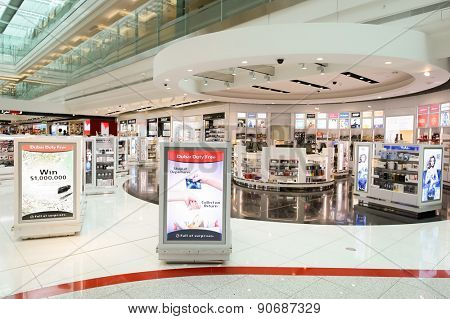 DUBAI - MARCH 10, 2015: Dubai duty-free shopping area interior. Dubai International Airport is the primary airport serving Dubai and is the world's busiest airport by international passenger traffic