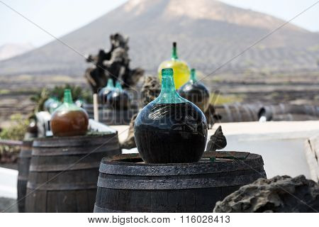 Barrels And Big Bottles With Grape Wine - Malvasia. Lanzarote Spain