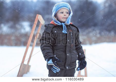 The Little Boy On A Winter Skating Rink Wriggles