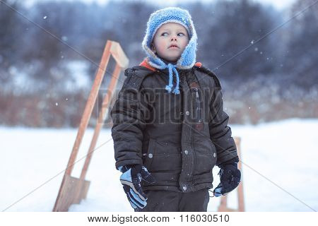 The Little Boy On A Winter Skating Rink Wriggles