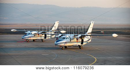 New white Let 410 airplane parked at the airport Baikal