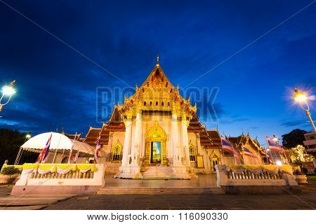 BangkokThailand-July 312015:Buddhist monk pray in the evening at Marble Temple Wat Benchamabopit Dusitvanaram in Bangkok Thailand