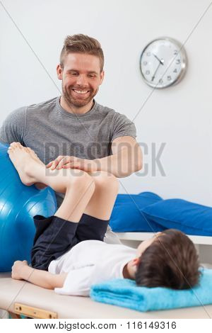 Physiotherapist Rehabilitating A Child