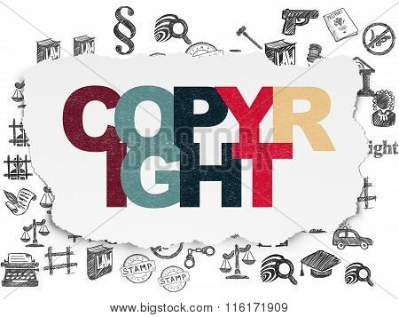 Law concept: Copyright on Torn Paper background