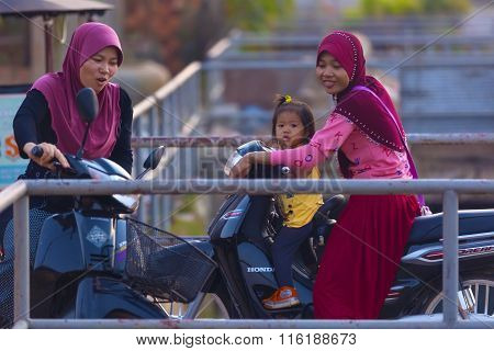 Muslim Cambodian Women On Motorbikes At Siem Reap City District Where Live Mostly Cambodians Of Isla
