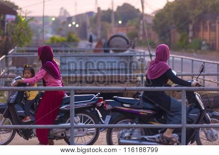 Muslim Cambodian Women On Motorbikes At Siem Reap City District Where Live Mostly Cambodians Of Isla