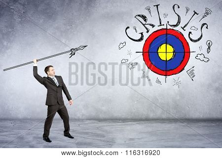 Businessman throwing spear to darts