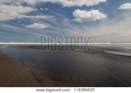 Black Sand On Piha Beach. New Zealand.