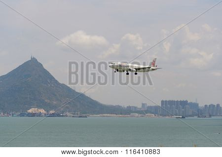 HONG KONG - JUNE 04, 2015: Dragonair aircraft landing at Hong Kong airport. Dragonair is a Hong Kong-based international regional airline