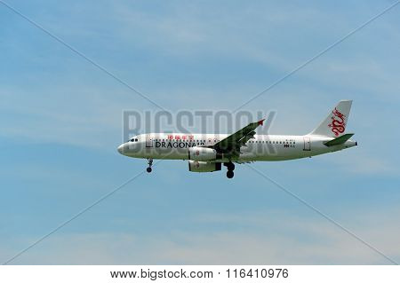 HONG KONG - JUNE 04, 2015: Dragonair aircraft landing at Hong Kong airport. Dragonair is a Hong Kong-based international regional airline