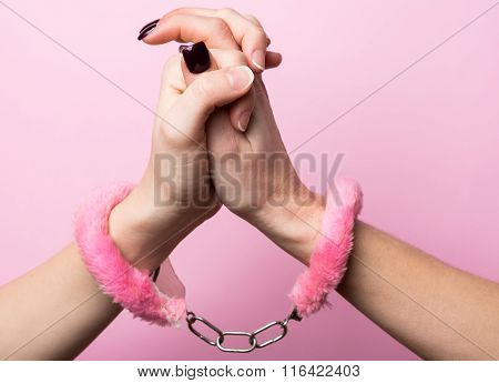 Homosexual Women With Handcuffs.concept For A Lifetime. Rose Background