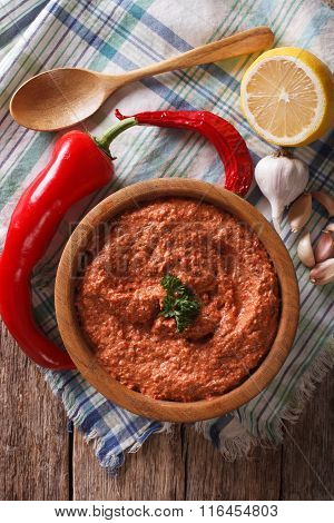 Red Muhammara And Ingredients Close-up. Vertical Top View