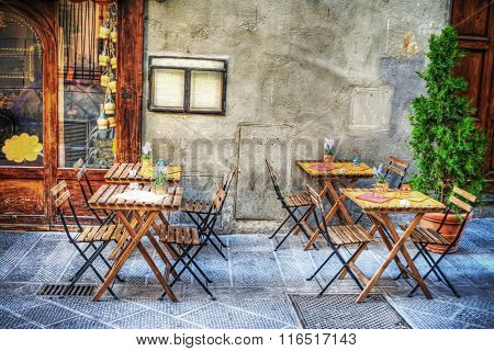 Rustic Tables And Chairs By A Trattoria In Florence