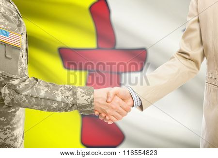 Usa Military Man In Uniform And Civil Man In Suit Shaking Hands With Canadian Province Flag On Backg