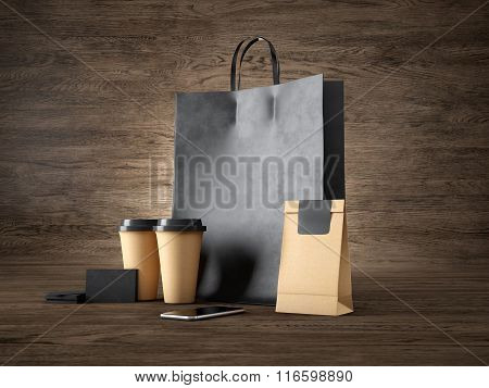 Set of black shopping bag, craft cups, paper package, blank business cards and generic design smartp