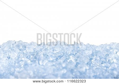 crushed ice in front of the white background .