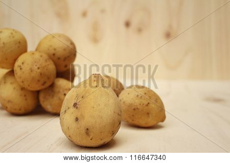 Longkongs On A Background Of Brown Wood.
